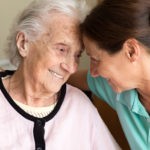 Dementia and Occupational Therapy – Home caregiver and senior adult woman